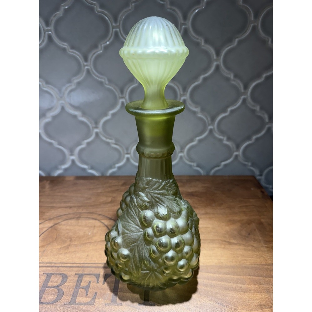frosted olive-green glass decanter featuring a raised harvest grape and vine